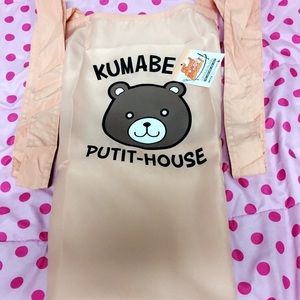 Kawaii aprint of a anime bear cooking.